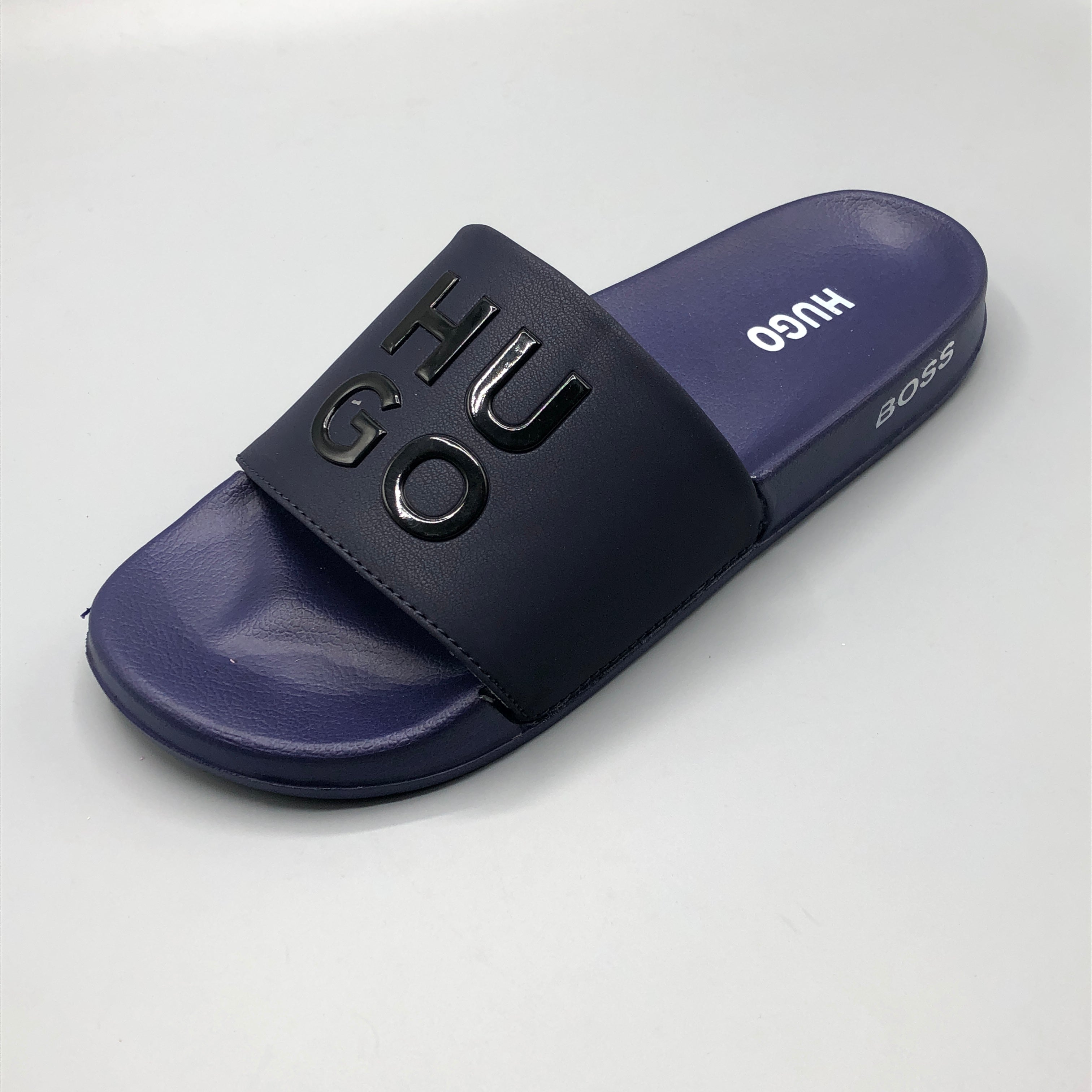 Navy , Non slip textured sole pattern of waterproof HUGO slides for wet floors