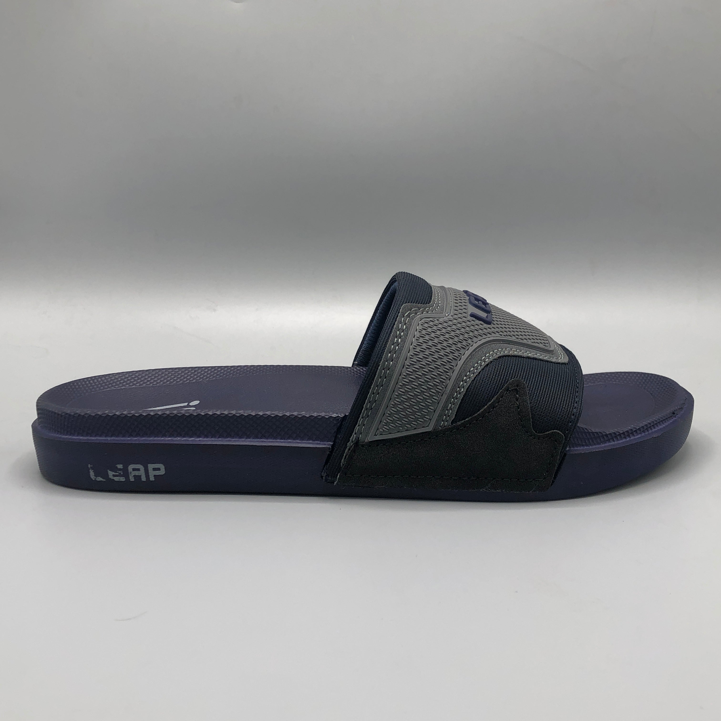Navy , Close up of textured mesh strap with grey TPU 3D LEAP logo on navy blue slipper
