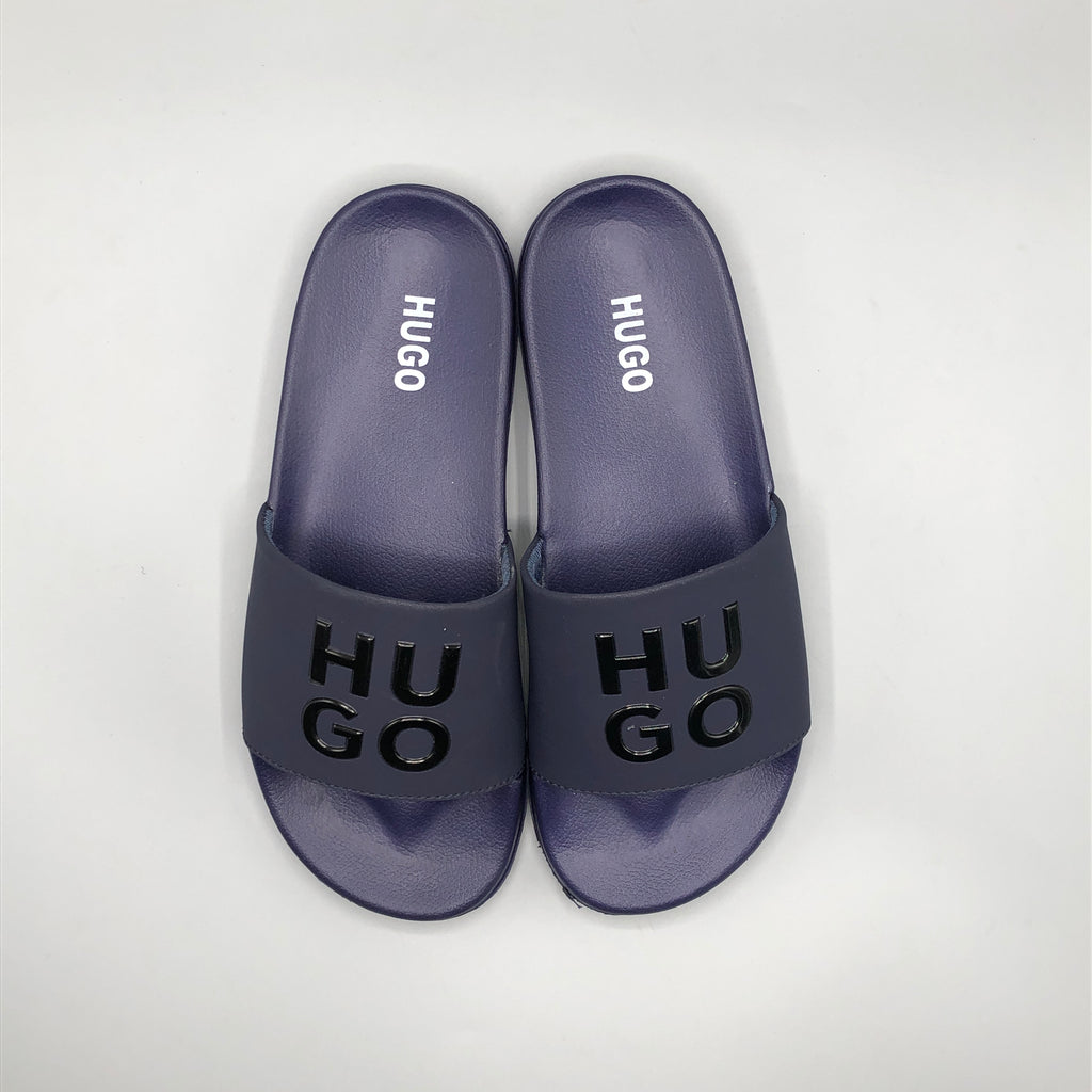 Navy , Model wearing HUGO navy blue casual chappal with denim jeans