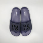 Navy , Model wearing HUGO navy blue casual chappal with denim jeans